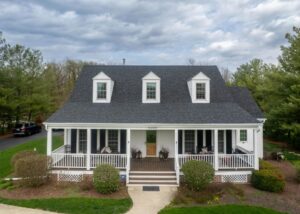 Front view of home with new roof and siding, highlighting fall-ready exterior renovation, improved curb appeal, and weather-ready durability.