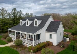 Beautiful home with new roof and siding, showcasing fall exterior renovation benefits, improved curb appeal, and protection before winter weather.