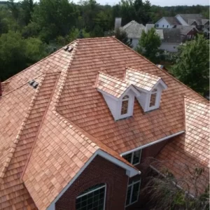 Cedar shake roof on a residential home with natural wood shingles, textured finish, and warm tones, showcasing durability and rustic curb appeal.